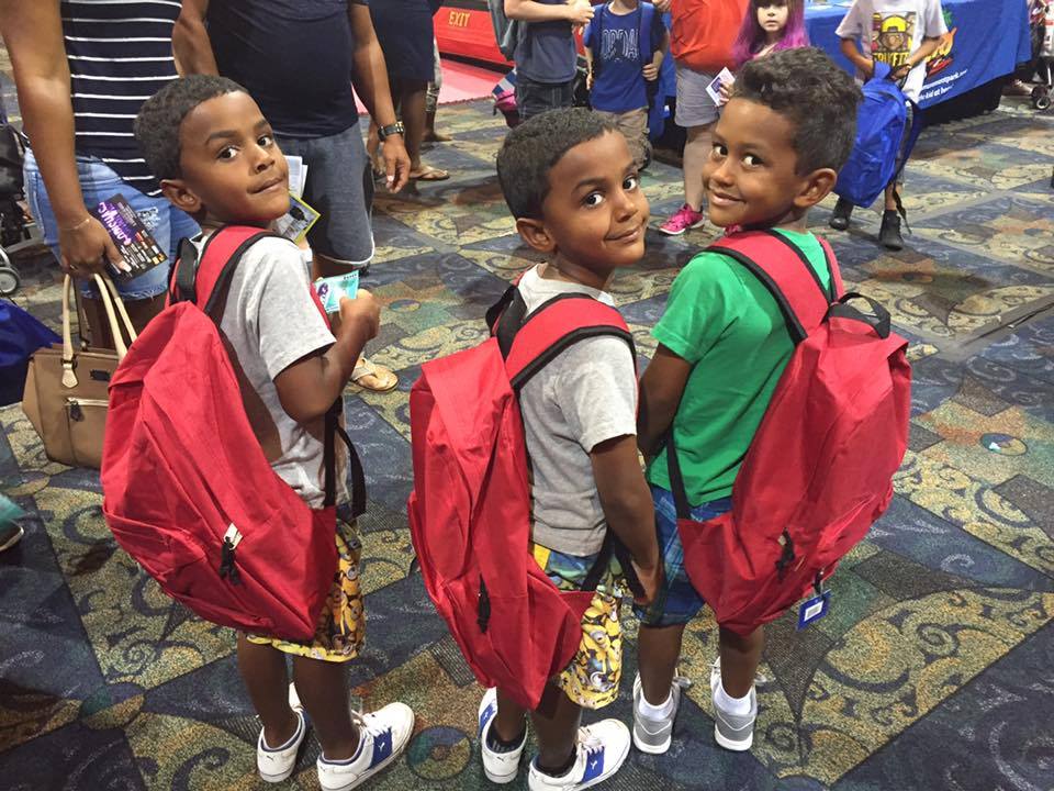 Smiles all-around, as 2,000 backpacks are given out to area children at 17th Annual Big Backpack Event