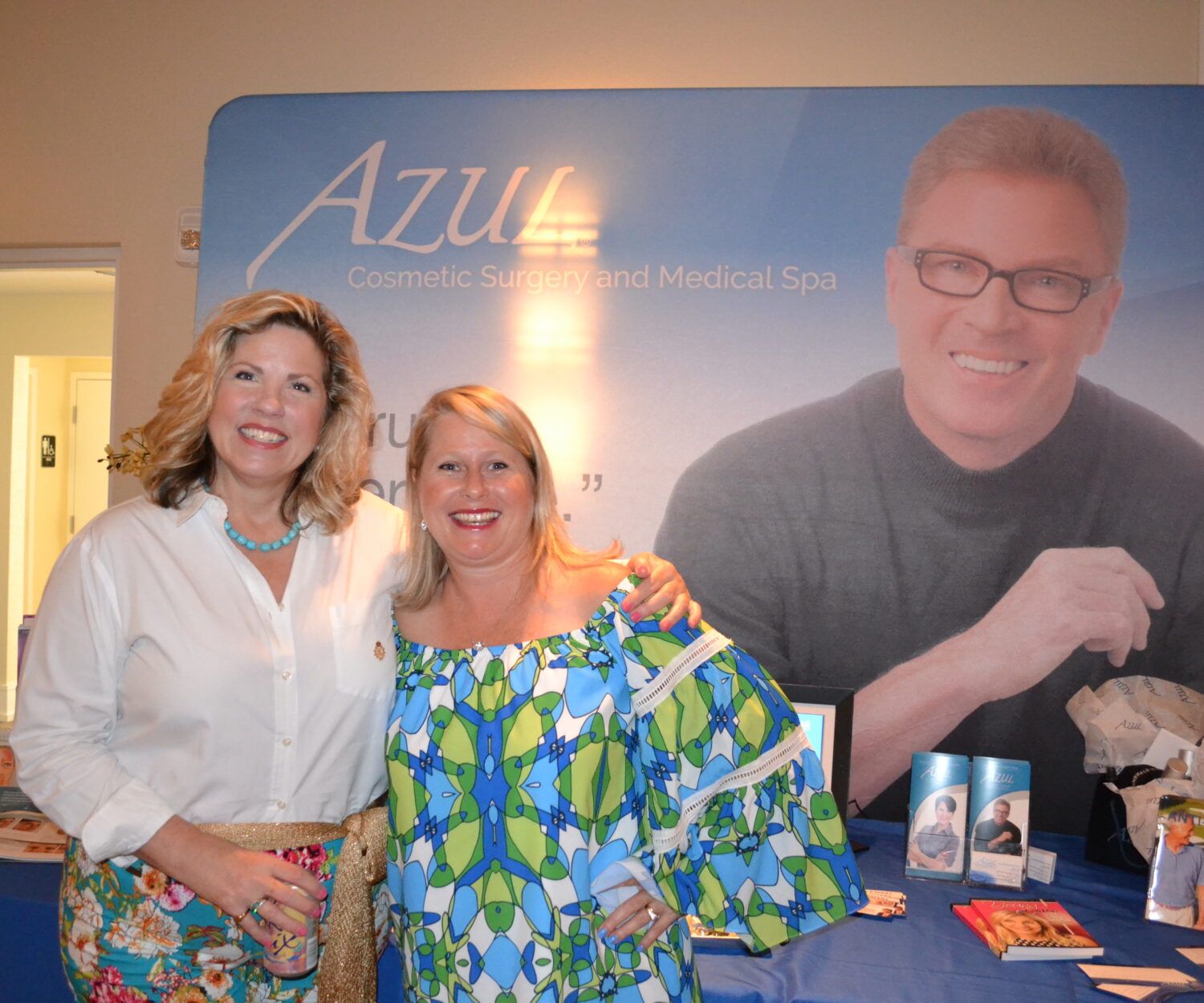 Linda Glaeser and Louanne Fisher of AZUL Cosmetic Surgery and Medical Spa stand in front of their vendor table featuring 

Dr. Patrick Flaharty at the Southwest Florida Optometric Association’s 38th Annual Educational Retreat.