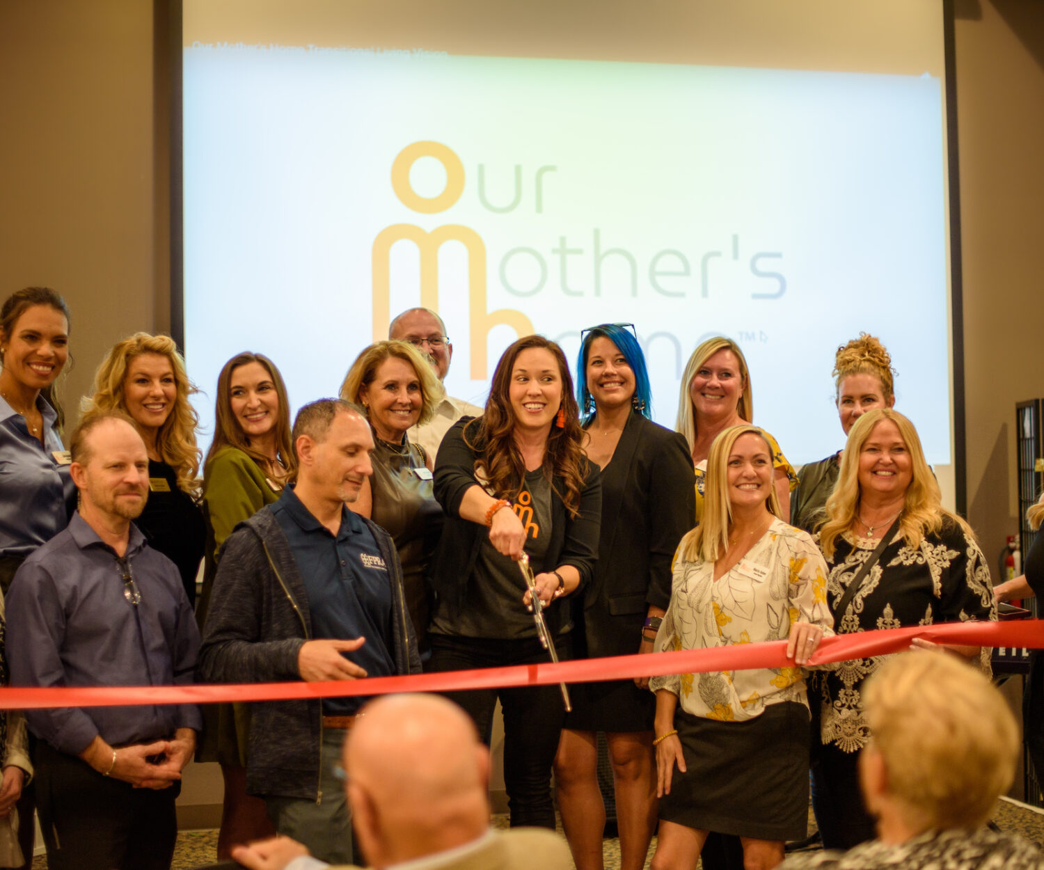 Our Mother’s Home ribbon cutting at its rebranding event held January 12