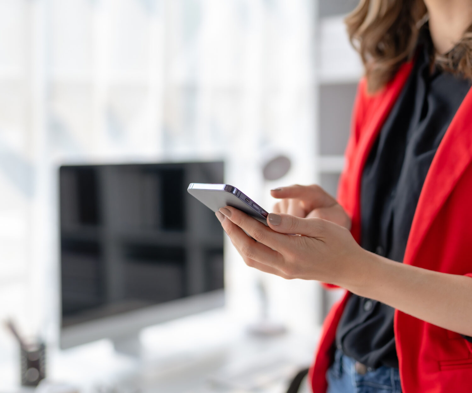 Close up of hands woman hand using smartphone typing, chatting conversation in chat box. Woman hands using smartphone at home, messaging or browsing social networks.